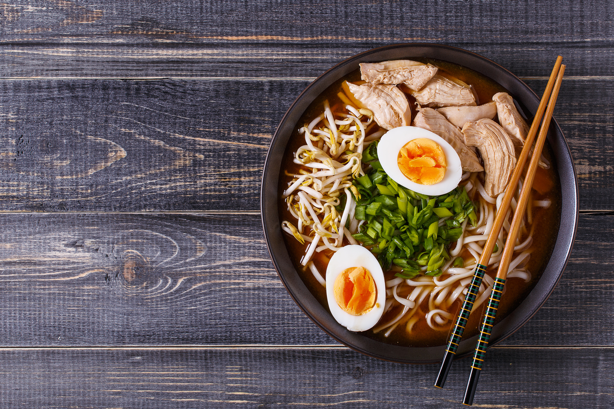 Japanese ramen soup with chicken, egg, chives and sprout.