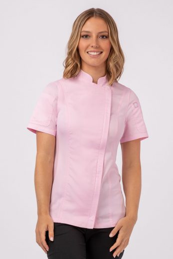 A woman wearing Chef Works’ Springfield Pink Chef Coat in the women’s fitted style as part of Chef Works Uniform Programs